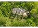 Luxury home features landscaped formal gardens, terraces, and patios in a lush, wooded setting at 32602 Archdale, Chapel Hill, NC 27517