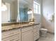 Granite vanity and white cabinets in spacious bath offers beauty and storage at 32602 Archdale, Chapel Hill, NC 27517