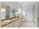 Elegant bathroom with a marble countertop, vanity, and walk-in shower at 32602 Archdale, Chapel Hill, NC 27517