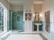 Large bathroom with shower, a second glass shower, a sink, and natural light from a window at 32602 Archdale, Chapel Hill, NC 27517