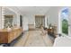 Bright bathroom with dual vanities, soaking tub, glass shower, and natural light at 32602 Archdale, Chapel Hill, NC 27517