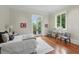 Serene bedroom with hardwood floors, natural light, and stylish decor at 32602 Archdale, Chapel Hill, NC 27517