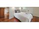 Comfortable bedroom with hardwood floors and two decorative pillows on a well-made bed at 32602 Archdale, Chapel Hill, NC 27517