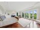 Large bedroom with hardwood floors and multiple french doors that lead to a balcony at 32602 Archdale, Chapel Hill, NC 27517