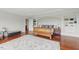 Spacious bedroom with hardwood floors, built-in bookshelves and large area rug at 32602 Archdale, Chapel Hill, NC 27517