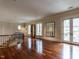 Spacious bonus room with hardwood floors, plenty of natural light, and access to outdoor balcony at 32602 Archdale, Chapel Hill, NC 27517