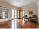 Large bonus room featuring hardwood floors, french doors to balcony, and adjacent seating area at 32602 Archdale, Chapel Hill, NC 27517