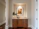 Charming butler's pantry with custom wood cabinetry, granite countertop, and built-in display niche at 32602 Archdale, Chapel Hill, NC 27517