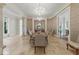 Formal dining room boasting decorative columns, chandeliers, and a sophisticated ambiance at 32602 Archdale, Chapel Hill, NC 27517