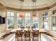 Dining room featuring large windows with natural lighting, designer light fixtures and wood floors at 32602 Archdale, Chapel Hill, NC 27517
