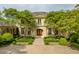 An attractive, luxury home with a manicured lawn and brick driveway offers great curb appeal at 32602 Archdale, Chapel Hill, NC 27517