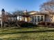 Well-manicured lawn showcases the grand exterior with gazebo, set in lush greenery at 32602 Archdale, Chapel Hill, NC 27517