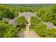 Stately two-story home with manicured landscaping, mature trees, and circle drive at 32602 Archdale, Chapel Hill, NC 27517