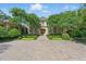 Stunning stone home with meticulously manicured landscaping and a circular driveway at 32602 Archdale, Chapel Hill, NC 27517