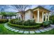 Exterior side view of home with manicured landscaping and covered porch at 32602 Archdale, Chapel Hill, NC 27517
