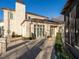 Beautiful stone house with large windows and doors, complemented by manicured greenery at 32602 Archdale, Chapel Hill, NC 27517
