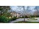 Elegant home featuring a circular driveway and manicured landscaping for a stately curb appeal at 32602 Archdale, Chapel Hill, NC 27517