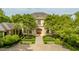Elegant exterior with a stately facade, beautiful landscaping and a circular driveway at 32602 Archdale, Chapel Hill, NC 27517
