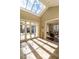 Sunlit foyer featuring skylight, light stone floors, French doors and glimpses into the home's interior at 32602 Archdale, Chapel Hill, NC 27517