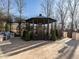 Outdoor gazebo with a fireplace and patio with outdoor kitchen, perfect for outdoor gatherings at 32602 Archdale, Chapel Hill, NC 27517