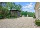Outdoor gazebo featuring a stone patio and lush landscaping at 32602 Archdale, Chapel Hill, NC 27517