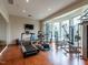 Spacious home gym featuring a variety of exercise equipment and large windows at 32602 Archdale, Chapel Hill, NC 27517