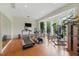 Home gym with a variety of exercise equipment and natural light from large windows at 32602 Archdale, Chapel Hill, NC 27517