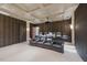 Private home theater with tiered seating, plush leather recliners, projector, and custom lighting for an immersive viewing experience at 32602 Archdale, Chapel Hill, NC 27517