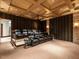 Comfortable home theater featuring tiered seating with leather recliners and a projector at 32602 Archdale, Chapel Hill, NC 27517