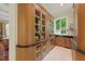 Bright Butler's pantry offering custom cabinetry, beverage center and sink at 32602 Archdale, Chapel Hill, NC 27517
