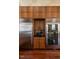 Kitchen featuring stainless steel refrigerators, custom cabinetry, and beverage refrigerator at 32602 Archdale, Chapel Hill, NC 27517