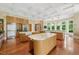Spacious kitchen features hardwood floors, ample counter space, and oversized islands, perfect for entertaining at 32602 Archdale, Chapel Hill, NC 27517