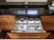 Custom kitchen cabinetry featuring stainless steel buffet drawer with food warming bins at 32602 Archdale, Chapel Hill, NC 27517