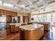 Spacious kitchen with dual islands, stainless steel appliances, and natural wood floors at 32602 Archdale, Chapel Hill, NC 27517