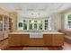 Well-appointed kitchen showcasing granite countertops, custom cabinetry, and a picturesque window view at 32602 Archdale, Chapel Hill, NC 27517