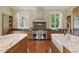 Gourmet kitchen boasting stainless steel appliances, double islands, and plenty of natural light at 32602 Archdale, Chapel Hill, NC 27517