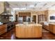 Well-appointed kitchen featuring stainless appliances, hardwood floors, granite counters, and ample storage at 32602 Archdale, Chapel Hill, NC 27517