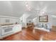 Charming kitchenette featuring white cabinets, stainless steel appliances, and a cozy seating area at 32602 Archdale, Chapel Hill, NC 27517