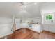 Bright kitchenette with white cabinets, granite countertops, and ample storage with adjacent sitting area at 32602 Archdale, Chapel Hill, NC 27517