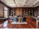 Spacious library with hardwood floors, coffered ceilings, wood bookcases and a fireplace at 32602 Archdale, Chapel Hill, NC 27517
