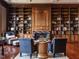 Large library featuring wood bookcases, hardwood floors, a fireplace and seating area at 32602 Archdale, Chapel Hill, NC 27517