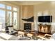 Sunlit living room with fireplace, hardwood floors, French doors and a serene ambiance at 32602 Archdale, Chapel Hill, NC 27517