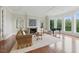 Bright living room with a fireplace, large windows, and hardwood floors at 32602 Archdale, Chapel Hill, NC 27517