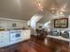 Spacious living room with updated kitchen, sleek wood floors and unique track lighting at 32602 Archdale, Chapel Hill, NC 27517