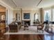 Bright living room with a fireplace, gleaming hardwood floors and access to more rooms at 32602 Archdale, Chapel Hill, NC 27517