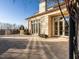 Expansive stone patio with ample space for outdoor dining and relaxation, perfect for entertaining at 32602 Archdale, Chapel Hill, NC 27517
