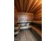 Home sauna, lined with wood, featuring built in benches and a heating unit at 32602 Archdale, Chapel Hill, NC 27517