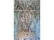 Modern shower featuring sleek glass doors and walls tiled with elegant marble, creating a luxurious and contemporary design at 32602 Archdale, Chapel Hill, NC 27517