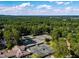 Overhead shot of community tennis courts surrounded by lush greenery, with ample space for recreation at 32602 Archdale, Chapel Hill, NC 27517