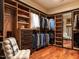 Spacious walk-in closet with custom built-in shelving and drawers, providing ample storage and organization at 32602 Archdale, Chapel Hill, NC 27517